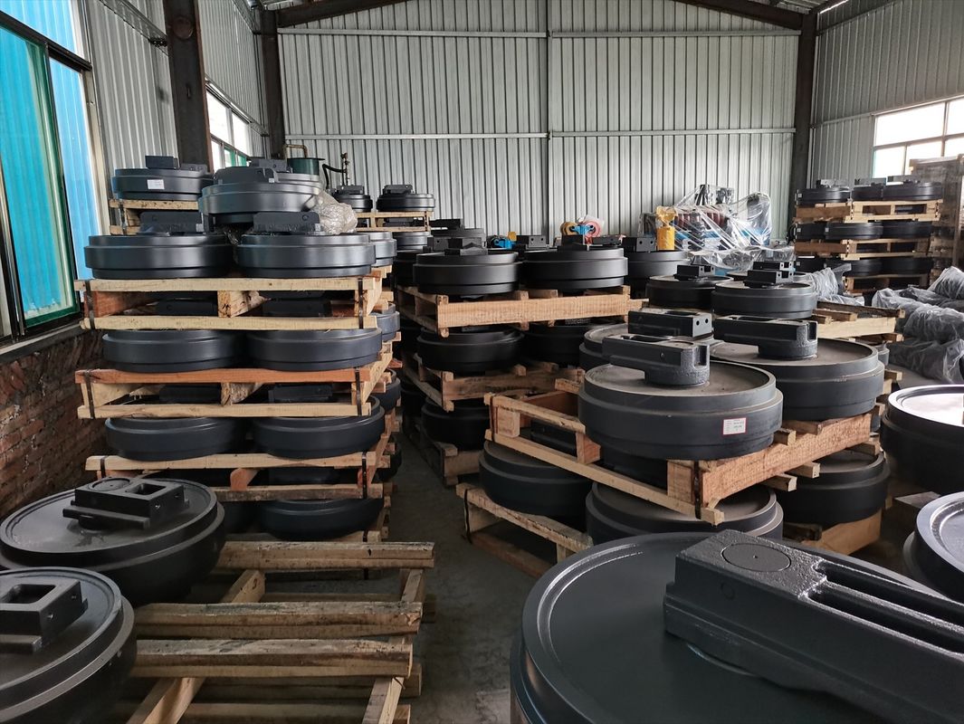 Đường dây đầu tiên idler assy cho mini excavator bánh xe bulldozer bộ phận cao su idler js220 pc20 pc60 pc200 pc300 ex120-2 js220